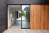Pocketing Sliding Glass Doors at Connection between Prefab Guest Wing and Existing Main House and Pool Deck