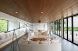Open Entertaining Space with Folding Glass Doors to Pool Deck on Main Level of Guest Wing