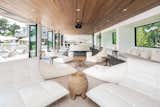 Open Entertaining Space with Folding Glass Doors to Pool Deck on Main Level of Guest Wing