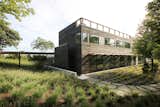 Rear Elevation of MODERN MODULAR Prefab Guest Wing with Guest Beds on Lower Level