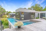The pool wraps around the southern side of the house.