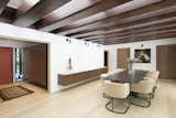 The central 'lanai' space, which houses the dining room and a lounge space, features original wood beams that were restored. A new Kalwall skylight system was installed above.