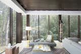The living space overlooks a thicket of bamboo to the rear.