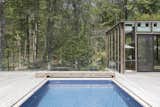 The original kidney shaped pool was replaced with a smaller rectangular pool, allowing for a more generous pool deck space - for play and lounging - without increasing the footprint.