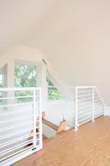 A built-in ladder connects to the small attic space, which has become popular during kids' sleepovers.