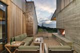 Arch Cape Residence by Colab Architecture + Design courtyard with outdoor fireplace
