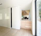 Just inside the front door, the foyer gives a brief glimpse of the great room.