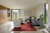 When construction was temporarily delayed, architect and homeowner set to work designing built-in cabinetry for every space, including the living room.