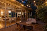 At night, it's easy to drift between indoors and outdoors, not only onto the cantilevered deck but also an adjacent patio.