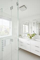 The  third-floor master bath, with its own glass-cubed shower area, looks right onto Green Street.
