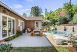 This 1947 midcentury in Altadena, California, features a T-shaped floor plan, a detached garage, and a backyard patio with a pool.