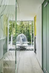 Fancy a meditative escape without leaving home? Consider the bubble chair hanging over a glassed-in rock garden at the top of the stairs.