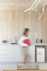 The kitchenette includes just a small refrigerator under the countertop and no cooking range (because of the boathouse's pairing with the main house), but can easily be converted to a full kitchen.