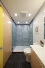 The bathroom shower also showcases Heath Ceramics tile.