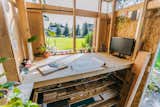 Opposite Tim's workstation is a stand-up drafting table and model-building area, which comes with a view of the back yard.