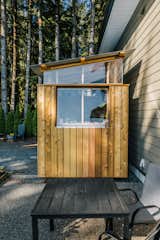 Sitting beside the couple's home, the Light Ribbon studio complements its lone traditional window with the project's namesake architectural feature: acrylic clerestories.  Photo 2 of 11 in Budget Breakdown: An Architect DIYs a Luminous Work Shed for $10K