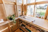 From inside, the combination of window and clerestory reads as one transparent view.  Photo 4 of 125 in The Mighty 300 by Kit Johnson from Budget Breakdown: An Architect DIYs a Luminous Work Shed for $10K