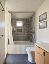 Both renovated bathrooms are outfitted with new Heath Cermics tile.