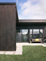 The couple chose Shou Sugi Ban siding, with an extra treatment to meet stringent fire codes.