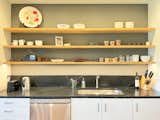 The kitchen features open shelving and soapstone countertops.