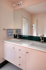 The double vanity in the middle of the upstairs family bathroom helps everyone get ready in the morning without traffic jams.