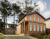 The pitched roof upstairs is set back from the flat-roofed main floor, breaking up its mass. The detached rear garage became an office for Moshe and firm partner Wayne Erb.