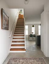 Concrete ground-floor flooring gives way to Douglas fir stairway treads.