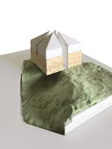 As seen in this model, the Kumagaya House straddles an uneven land parcel sloping on one side, which reveals a portion of the home's basement.