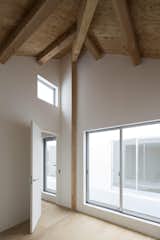 Upstairs, which includes the same oak flooring as downstairs, is devoted to two bedrooms facing an open-air inner balcony.