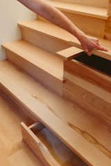 Built into the bottom of the basement stairs are widened treads that include storage.  Photo 15 of 28 in Before & After: A Flooded Basement Kicked Off a Family’s Whole-Home Renovation in Montana