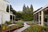 The retouched meadow between the house and its detached garage/guest room was given a stone walking path.