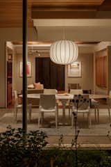 Even though the living room is located in the original home, it reads as part of the rebuilt extension that holds the dining area and kitchen.