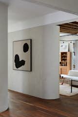 That same curved wall, seen from the hallway. By curving the wall's edges, the doorway openings and sight lines are enlarged.