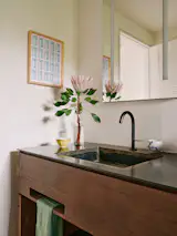 The same salvaged redwood used in the kitchen was also used in the second bathroom.