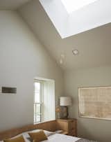 Thew renovated primary bedroom on the third floor feels perhaps more spacious than anywhere in the home, thanks to the vaulted ceiling and skylight.