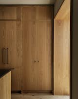 The custom millwork, fabricated by Loubier Design, was meant to celebrate the movement of the natural grain.