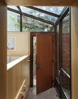 The new sun-room addition provides a new entrance for the family, including a mudroom with storage for shoes.