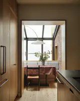 The glass-enclosed sun room just off the kitchen fills the entire ground floor with natural light.