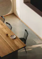 Simple concrete floors have provided the durability Mike and Elaine sought with two young children and a love of entertaining friends and family. The Plane dining table is by Sundays, and the Ironica chairs by Ton.