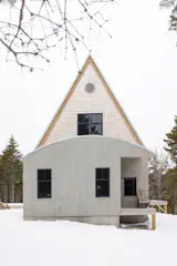 The master bedroom at the back of the house. "When I drew the plans, I needed another 5’ for the bedroom, so I extended back beyond the gable truss,