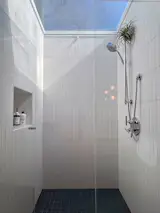 The renovated shower in the primary bathroom.