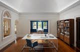 Office, Medium Hardwood Floor, Bookcase, Storage, Desk, Shelves, Dark Hardwood Floor, Chair, and Study Room Type  Photo 8 of 19 in Dundee House by Traction Architecture