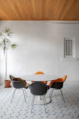 Dining Room, Ceiling Lighting, Porcelain Tile Floor, Table, Chair, Pendant Lighting, and Ceramic Tile Floor  Photo 12 of 19 in Dundee House by Traction Architecture