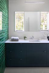 Bath Room, Ceramic Tile Floor, Pendant Lighting, Ceramic Tile Wall, Open Shower, Engineered Quartz Counter, Ceiling Lighting, One Piece Toilet, and Drop In Sink  Photo 15 of 19 in Dundee House by Traction Architecture