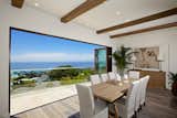 Featuring LaCantina's Contemporary Clad Folding System Bronze Anodized Exterior Finish and Sapele Mahogany Wood Interior. 