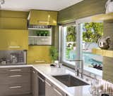 Christopher Kennedy Compound 2015 featuring LaCantina's Aluminum Pocket Sliding Servery Window System with clear anodized finish in kitchen.
