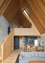 The vaulted roof maximizes space within the Bunkie’s small footprint, creating a spacious feel with a lofty ceiling that connects both levels.