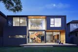 A wide deck across the back of the house effectively doubles the living/dining area, becoming a generous outdoor room in temperate months. The rear facade’s protruding and extending volumes form covered zones and roof decks, delineating outdoor areas with differing character.