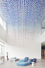 The porous installation breaks the triple-height lobby into a thousand different interstitial spaces, creating a more immersive experience for visitors.