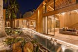 Exterior, Curved RoofLine, Wood Siding Material, Beach House Building Type, Stucco Siding Material, Glass Siding Material, and Tile Roof Material  Photo 1 of 16 in Al Suave House by Cincopatasalgato